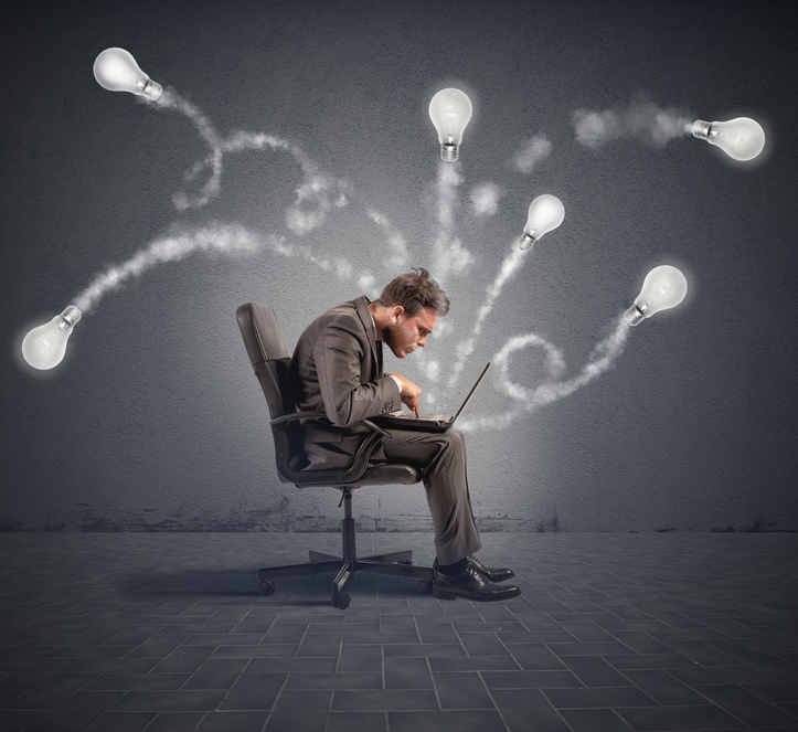 Genius work with a laptop sitting in a chair