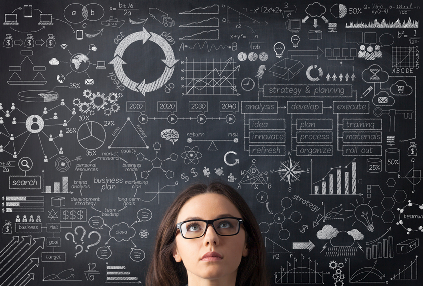 Businesswoman idea concept on blackboard